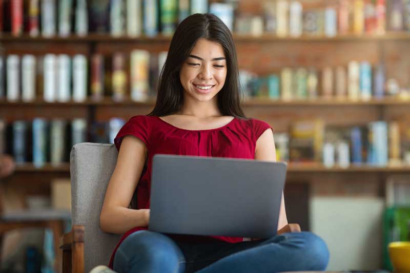 student working at a laptop